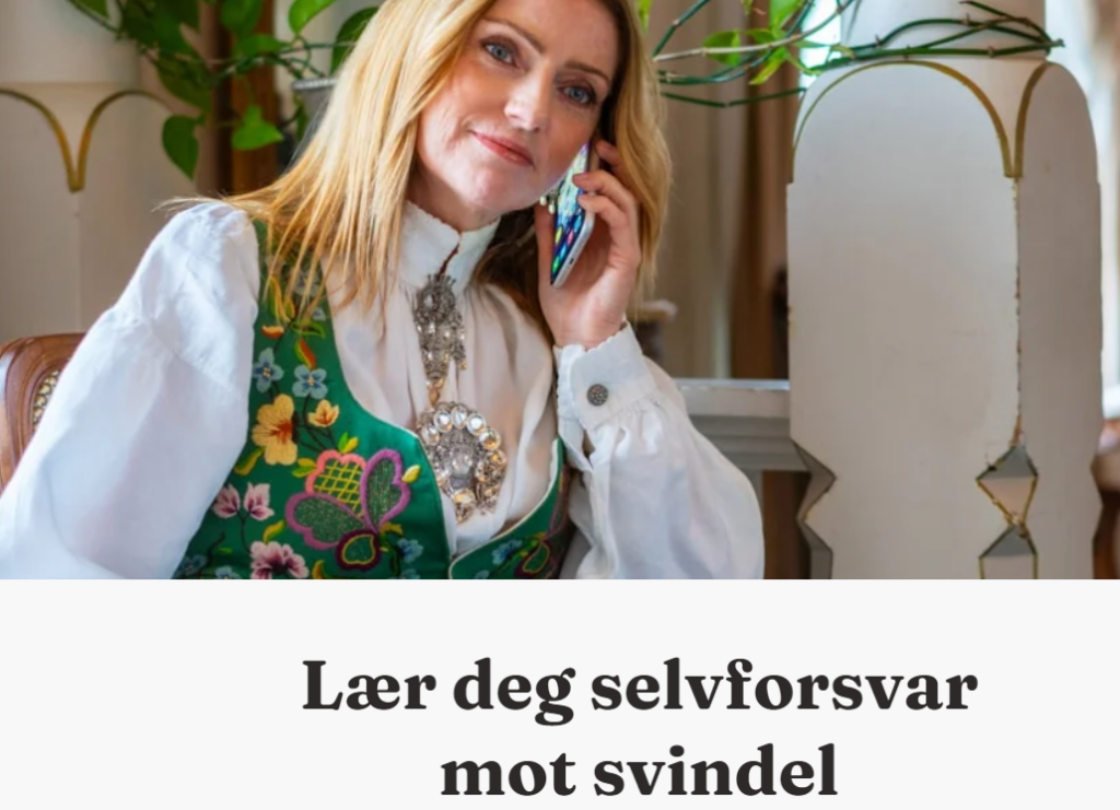 Dame i bunad snakker i telefonen